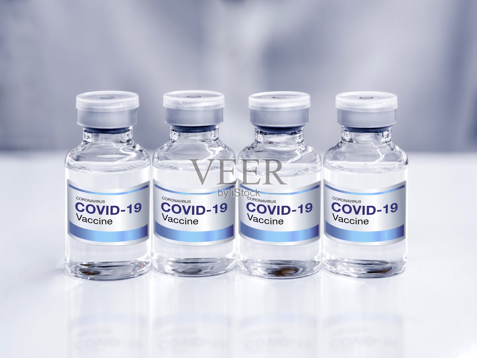 带标签的Covid-19冠状病毒疫苗瓶。照片摄影图片