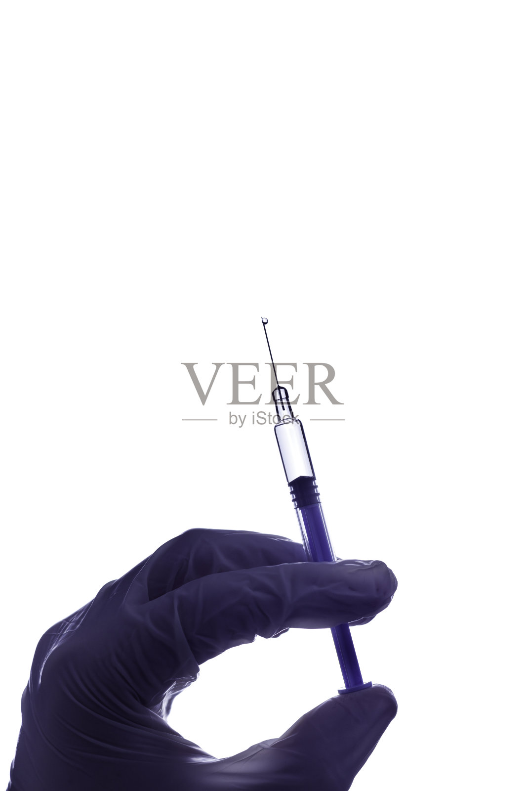 疫苗注射主题：医生手中的注射器照片摄影图片