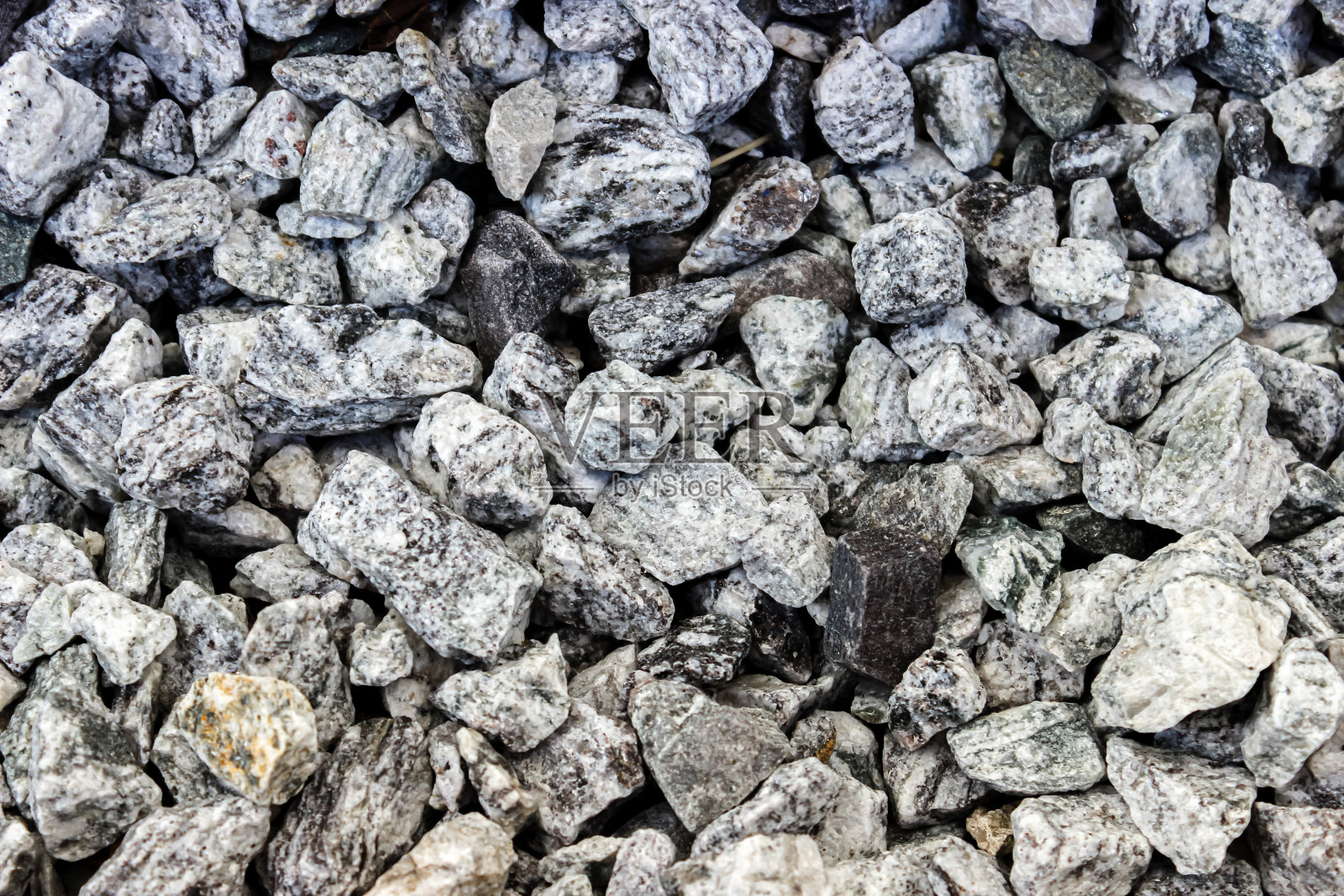 背景的石头和砾石。表面有许多石头照片摄影图片