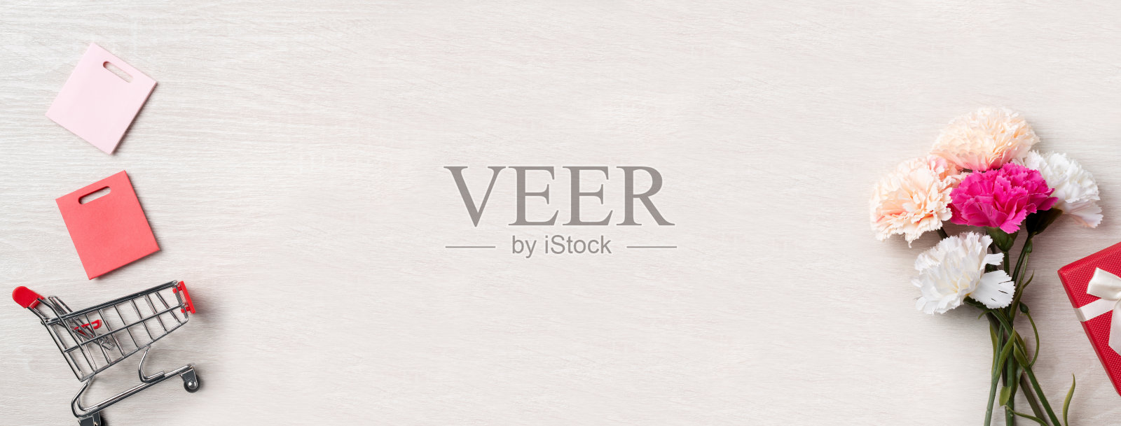 设计理念与康乃馨鲜花母亲节问候和节日礼物的想法。照片摄影图片