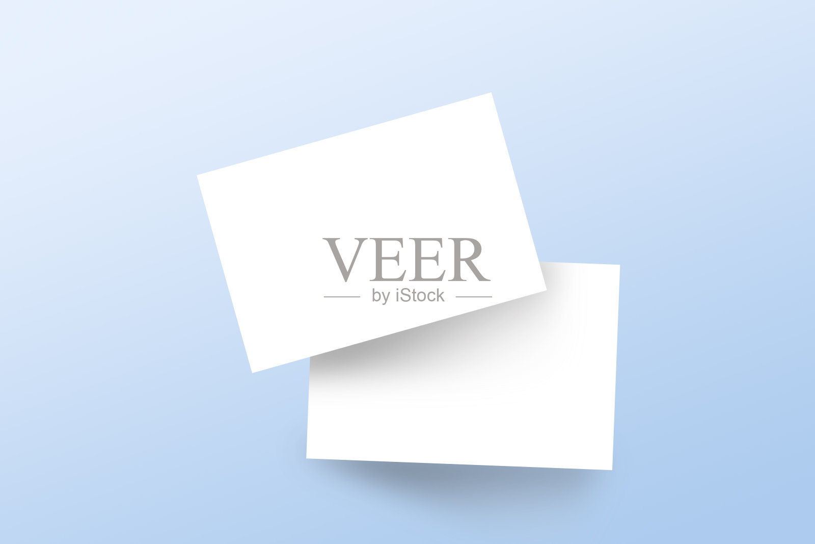 真实的模型品牌名片模板与阴影在浅蓝色的背景。平躺，俯视图。照片摄影图片