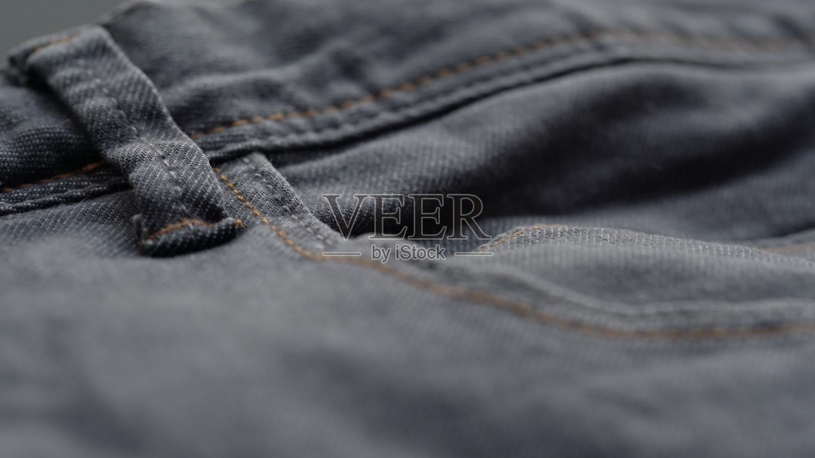 款式新颖的灰色牛仔裤口袋照片摄影图片