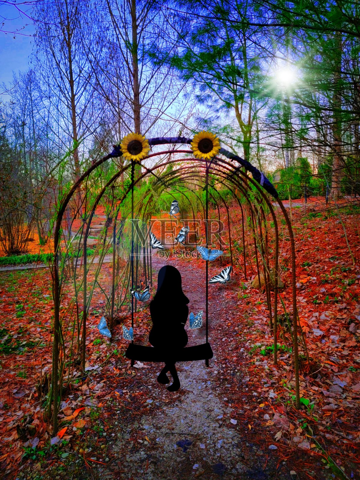 藤蔓上荡秋千的女孩照片摄影图片