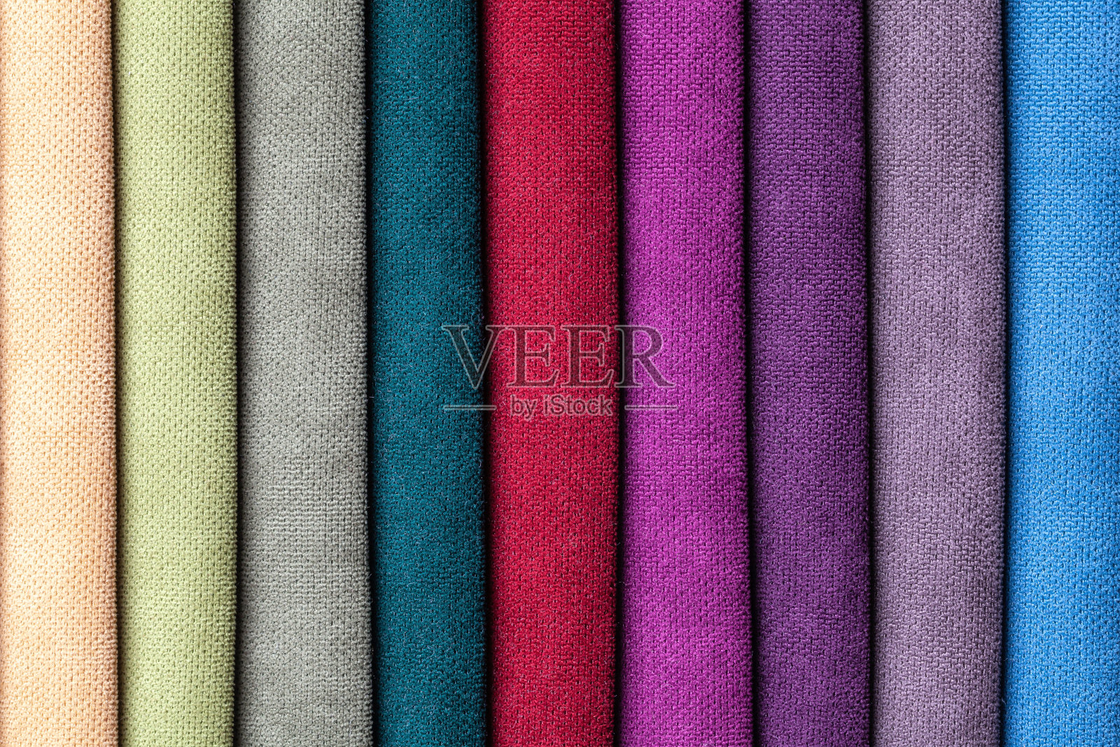 各种颜色、底色的丝绒及丝绒纺织品样品。照片摄影图片