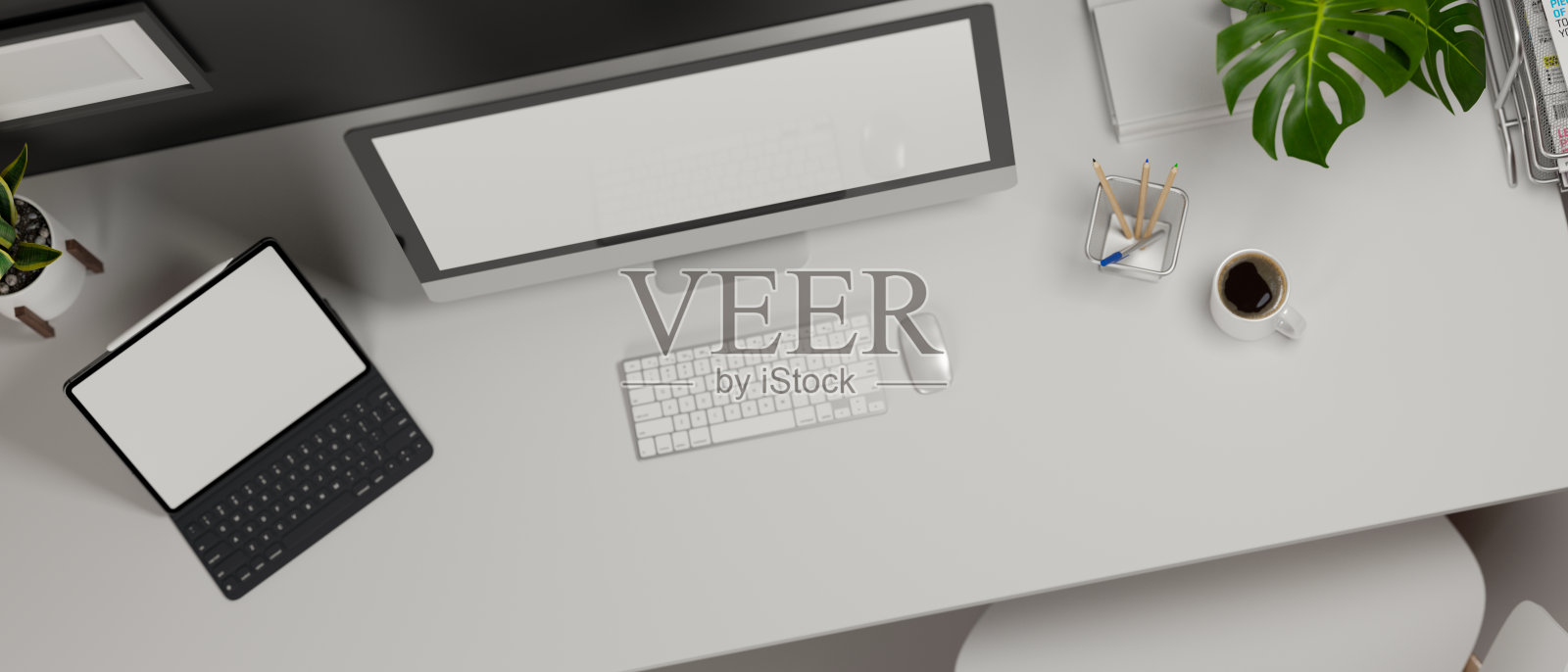 3D渲染，工作空间与电脑，数字平板电脑，用品和装饰在白色的桌子上照片摄影图片