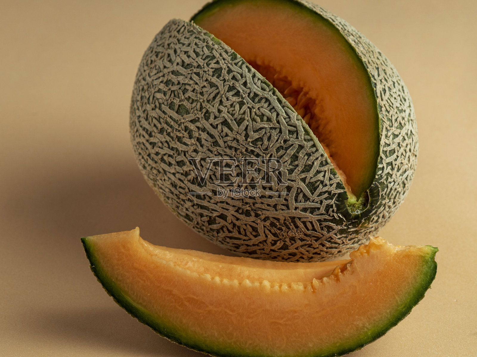 甜瓜面皮香甜，鲜嫩多汁。照片摄影图片