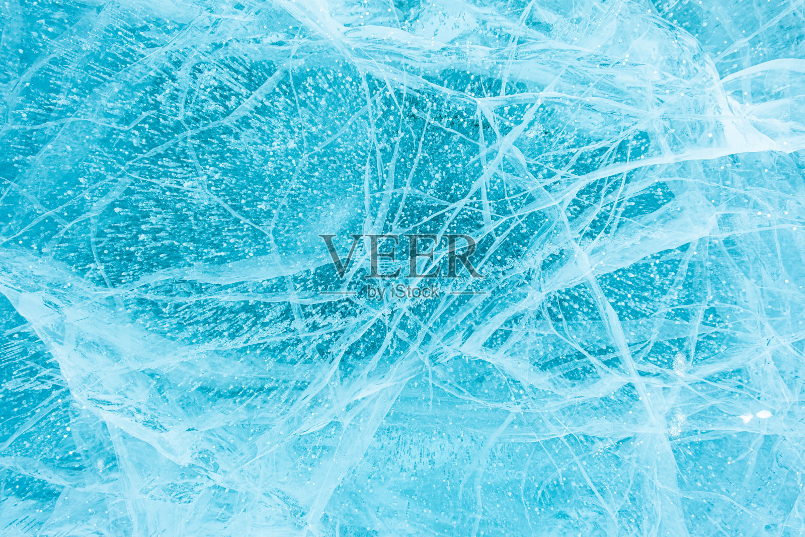 美丽的蓝色冰的质地。照片摄影图片