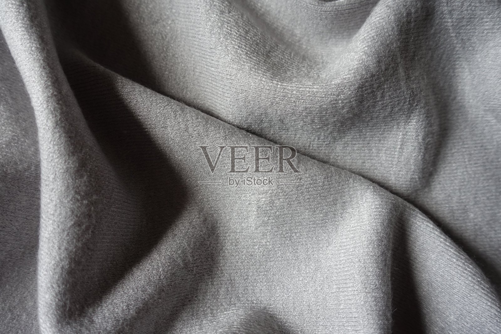 从上面折叠简单的灰色针织棉织物照片摄影图片