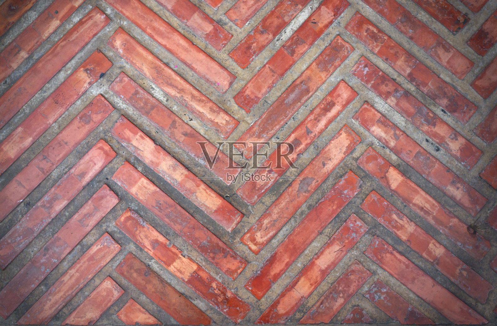 红橙色砖地砖，具有锯齿形花纹纹理照片摄影图片