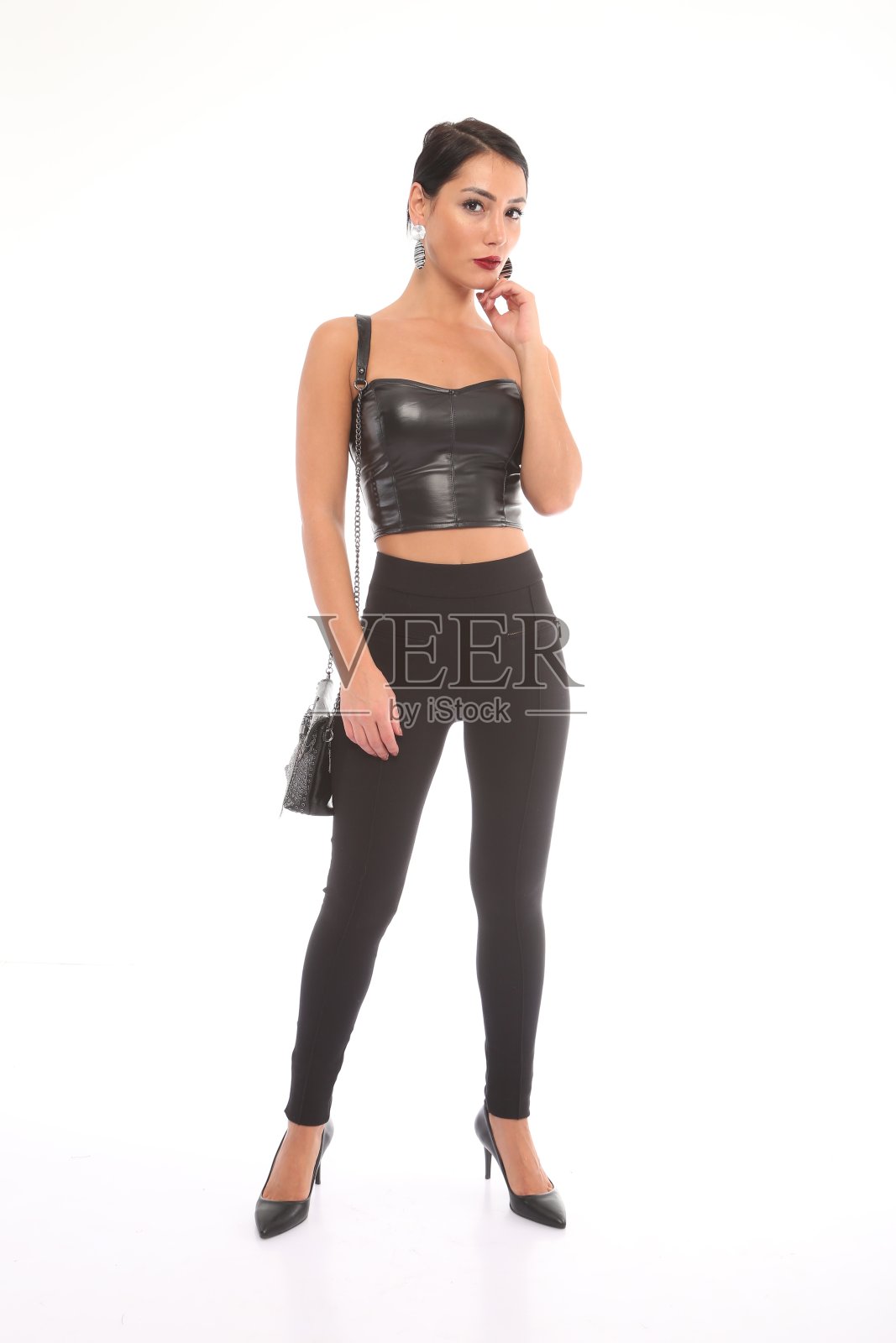 美丽的女人结合皮革胸衣。照片摄影图片