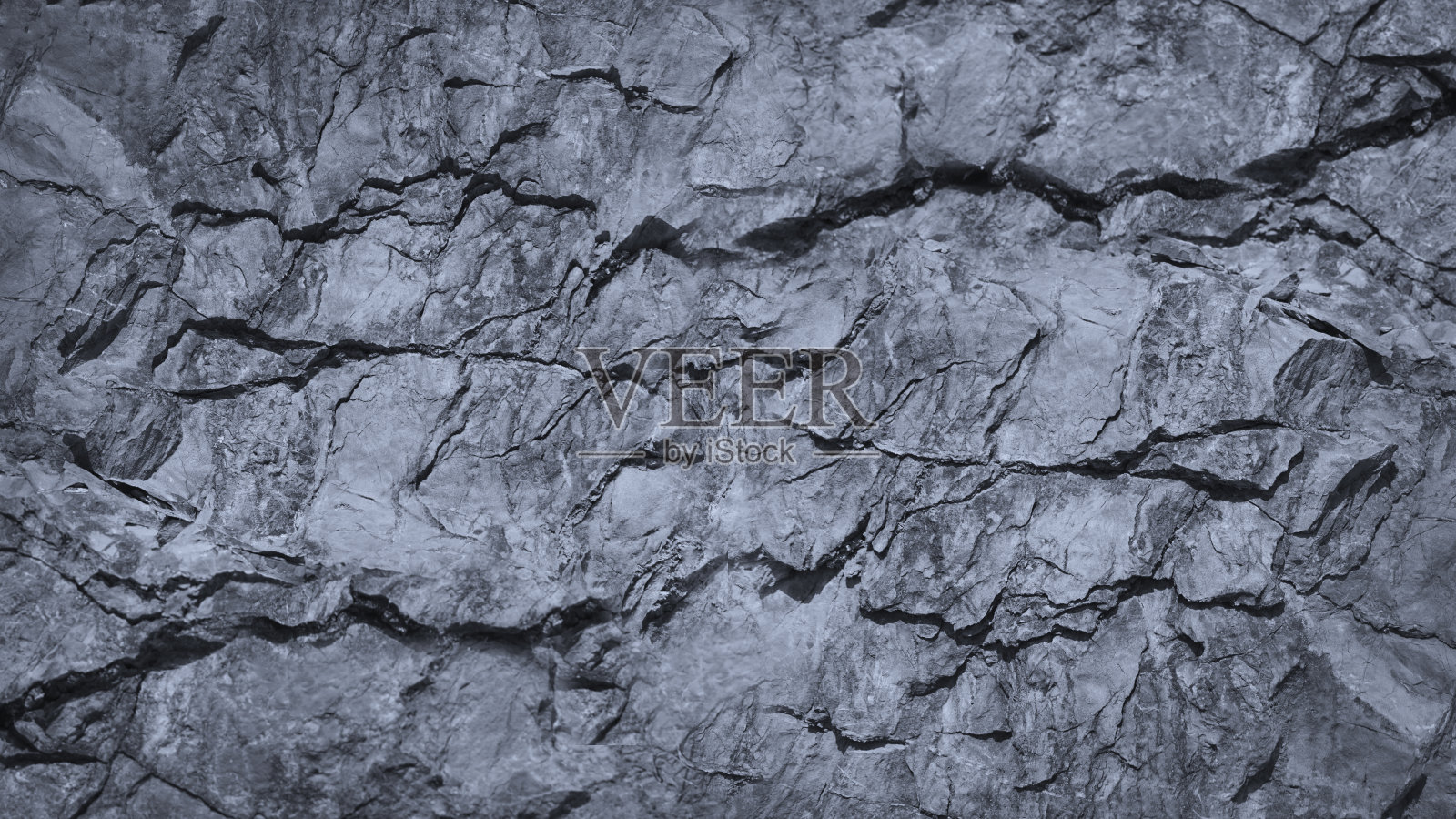 灰色岩石纹理，有裂缝。石墙背景与文本和设计的复制空间。宽横幅。照片摄影图片