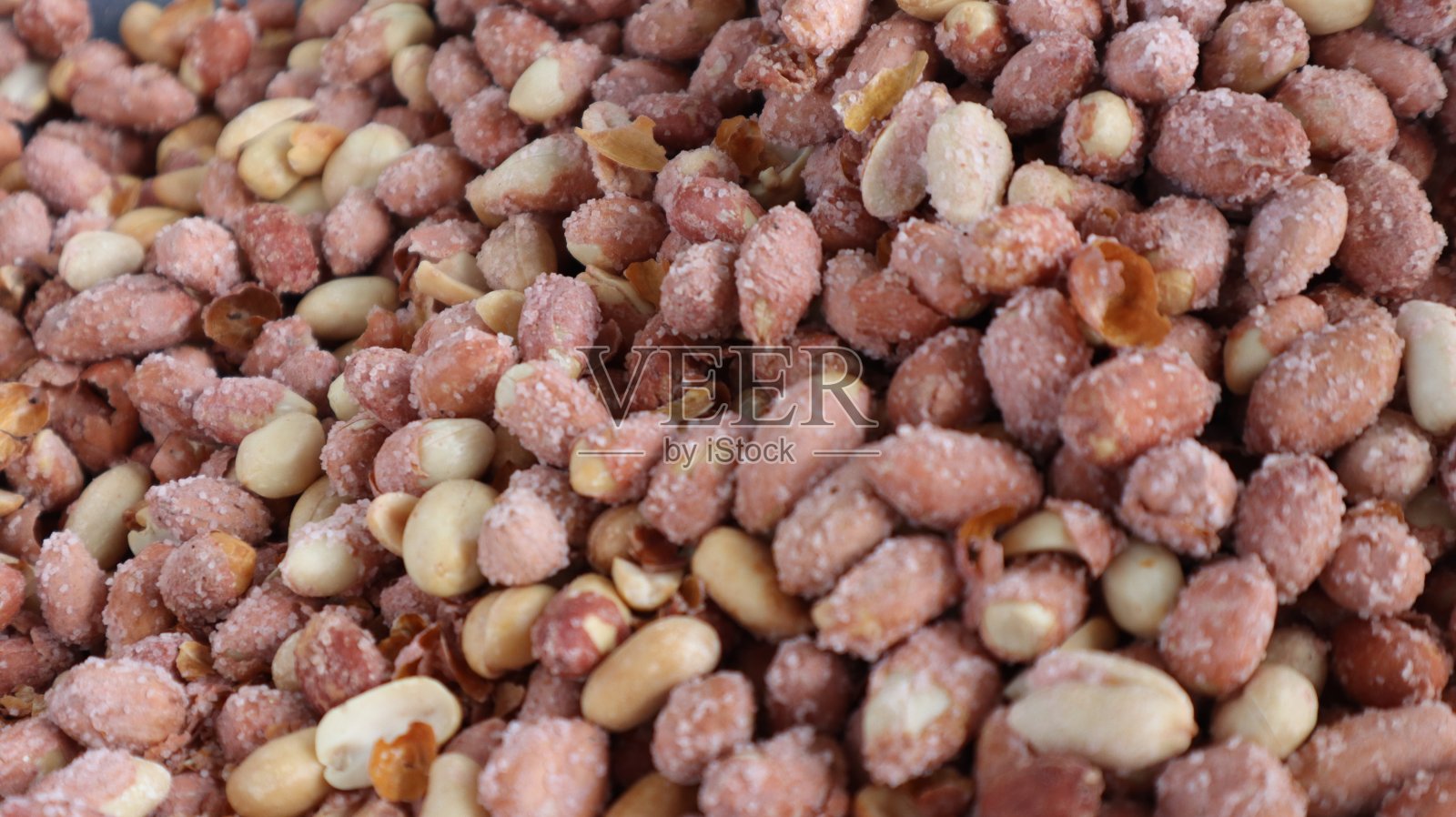 素食健康烤花生背景。照片摄影图片