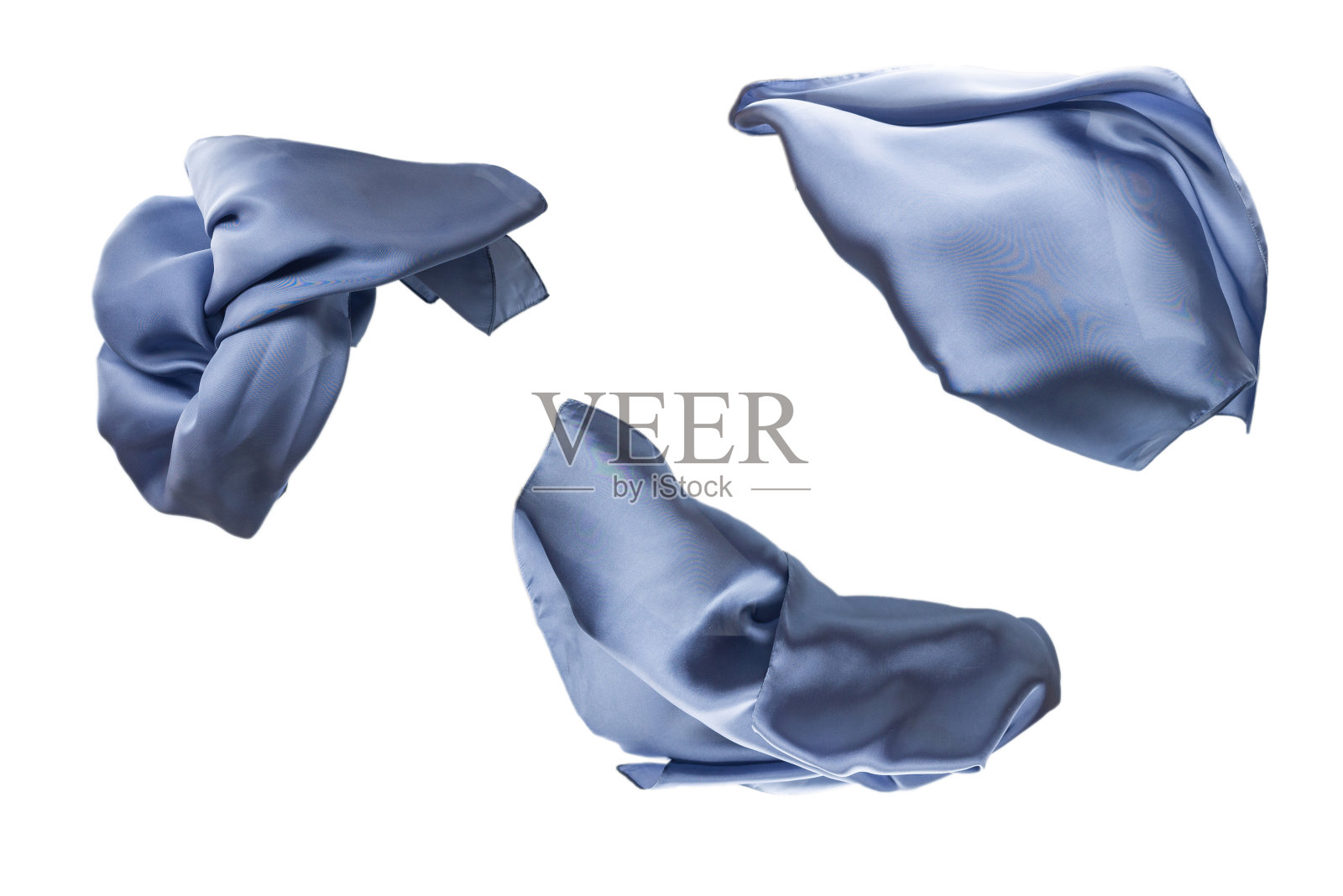 飘逸的蓝色丝巾孤立在白色背景上。照片摄影图片