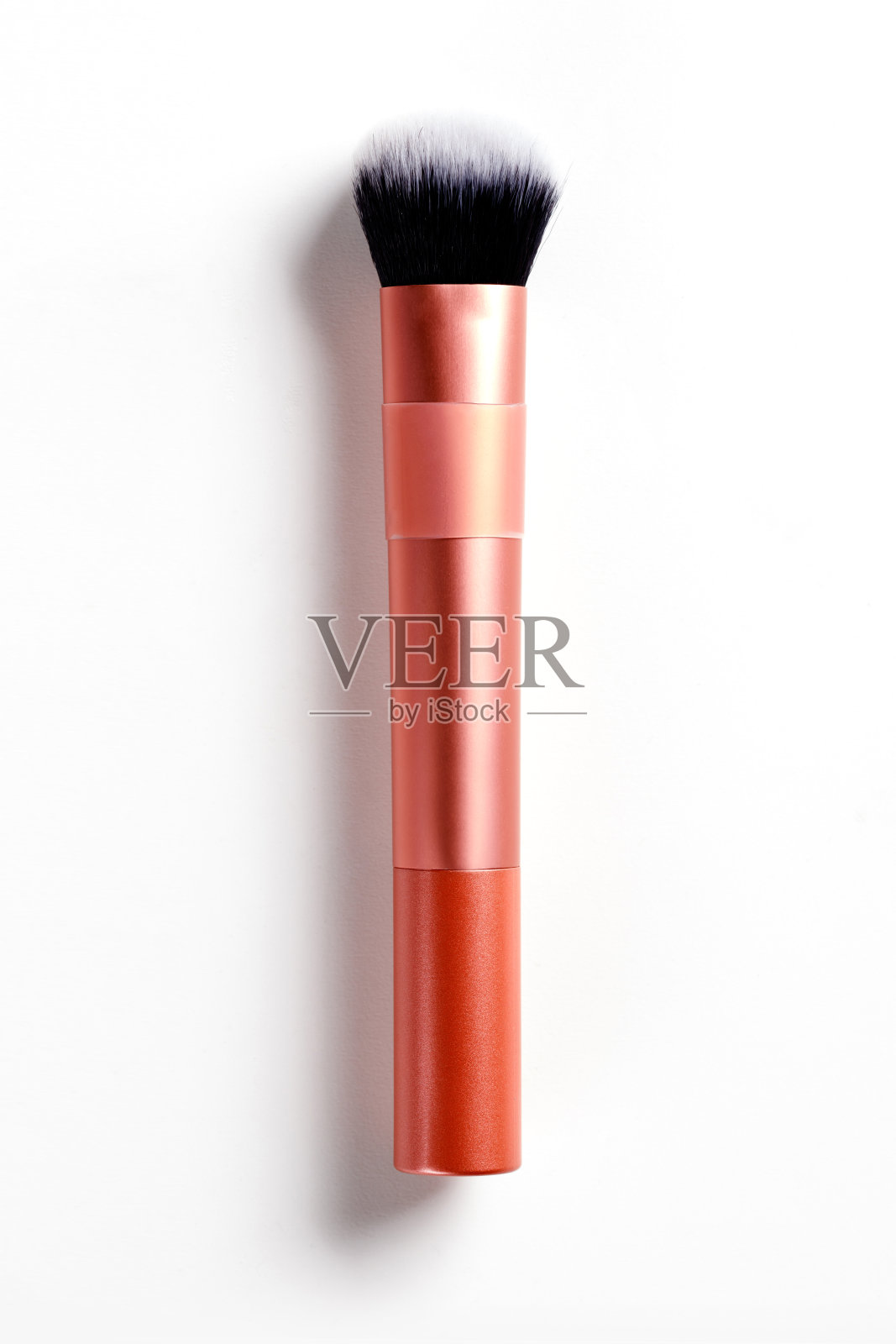 化妆刷在橙色的容器照片摄影图片