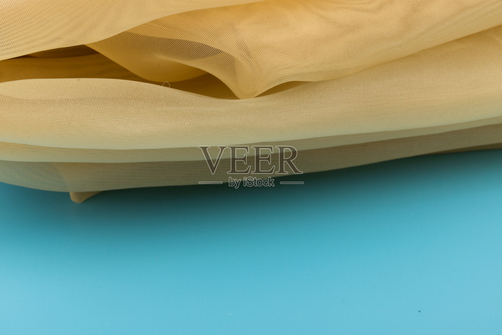 黄色薄纱织物纹理与美丽的特写和优雅的细节织物背景照片摄影图片