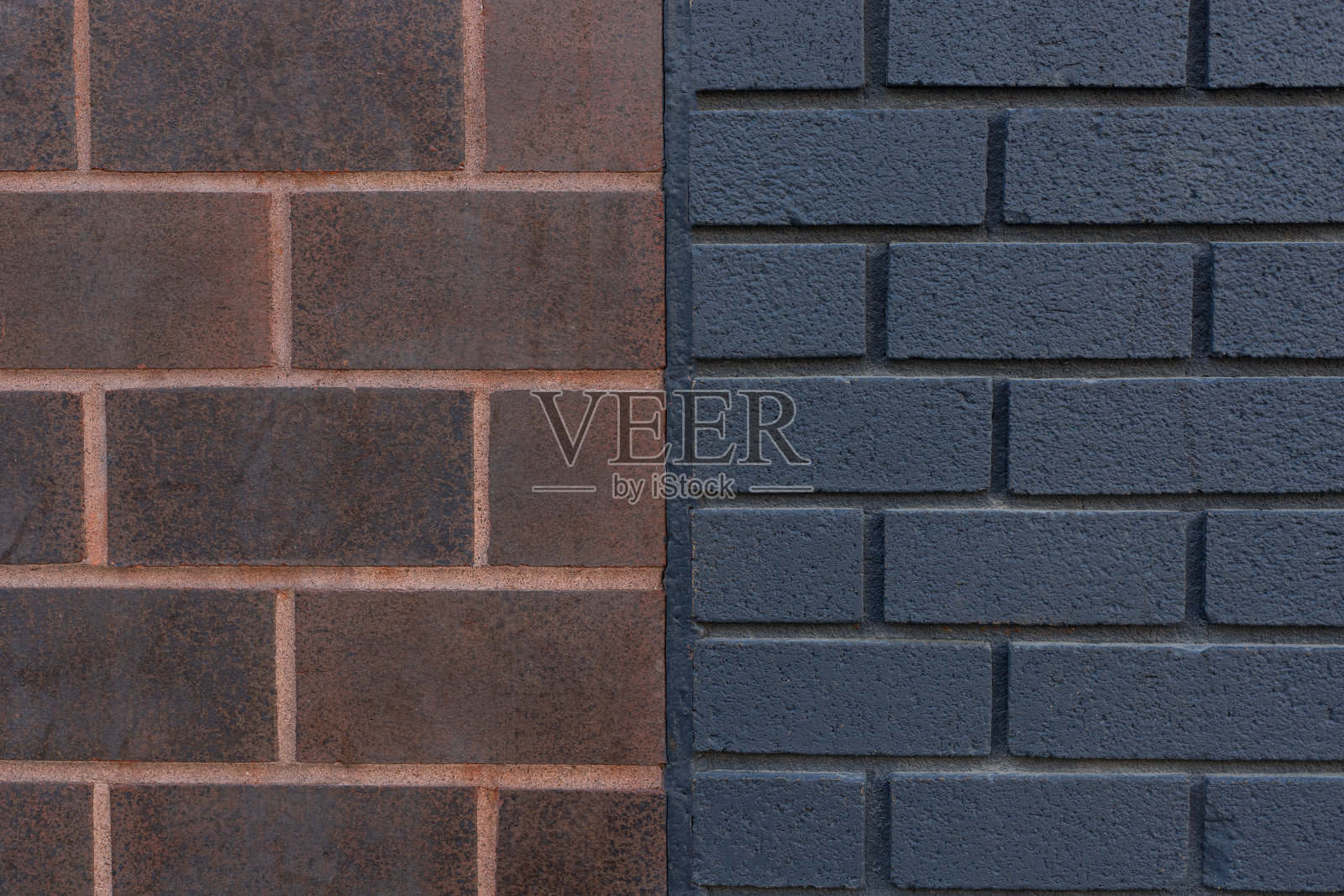 暗橙色和黑色砖墙纹理背景特写。照片摄影图片