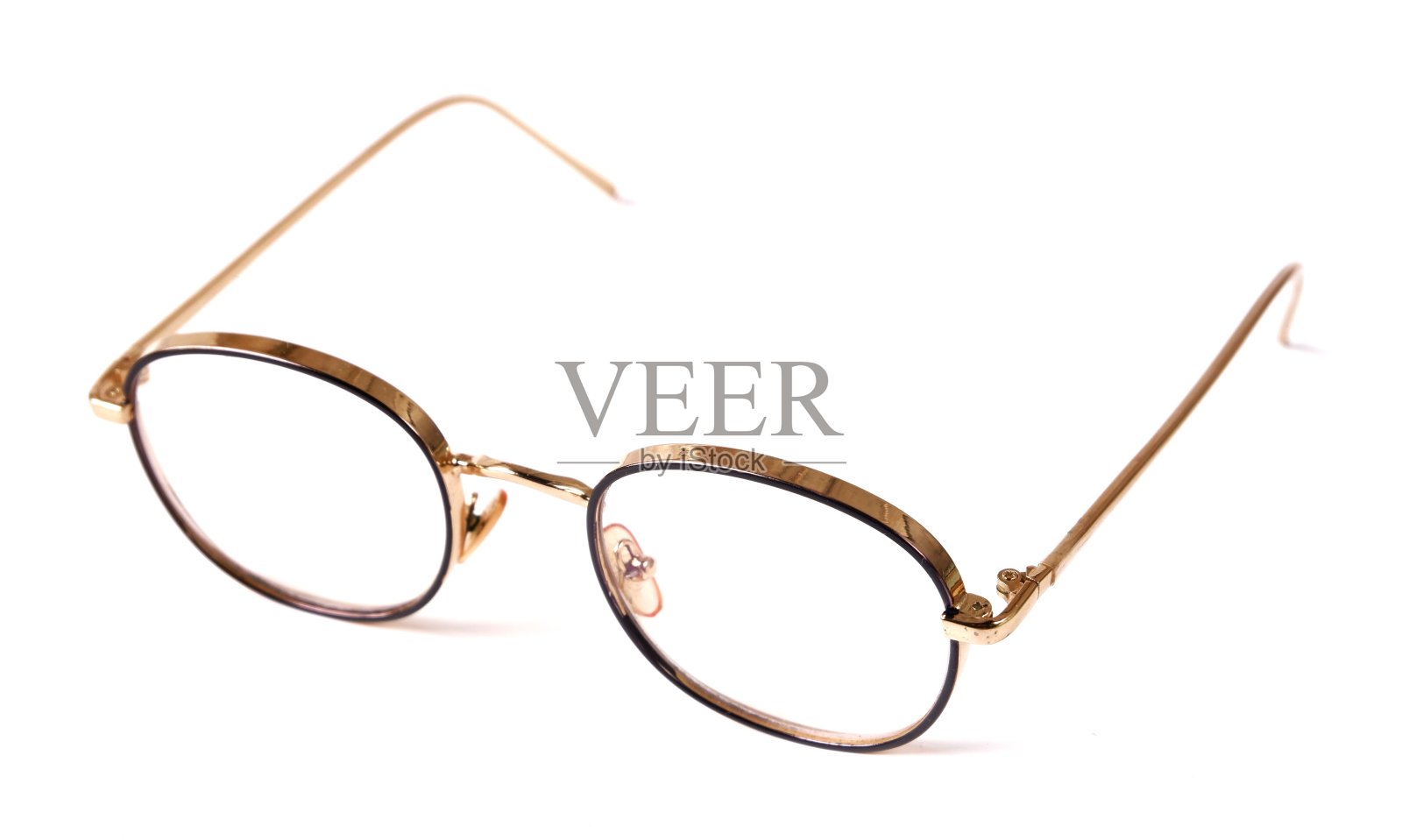 美丽的金色眼镜，孤立在白色背景上照片摄影图片