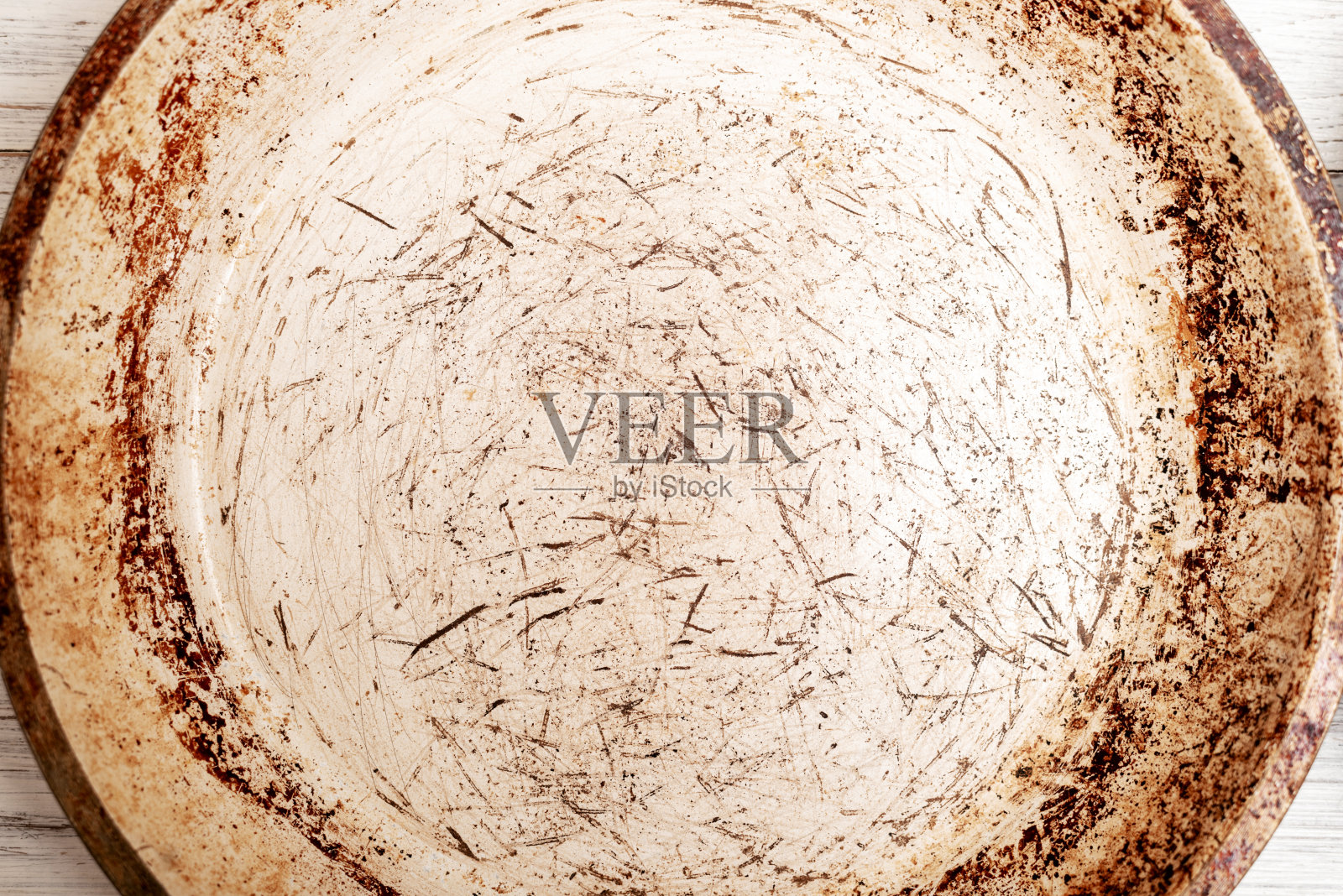 煎锅表面破损。挠不粘涂层。照片摄影图片