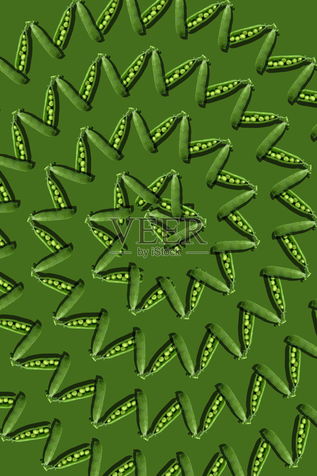 绿色背景上的豌豆照片摄影图片