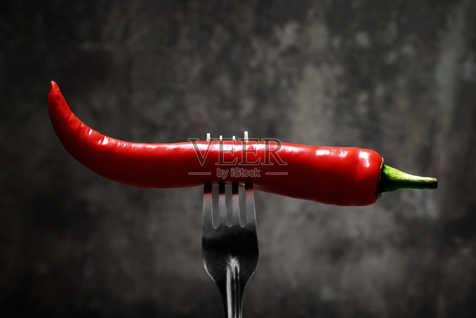 叉子上放红辣椒照片摄影图片