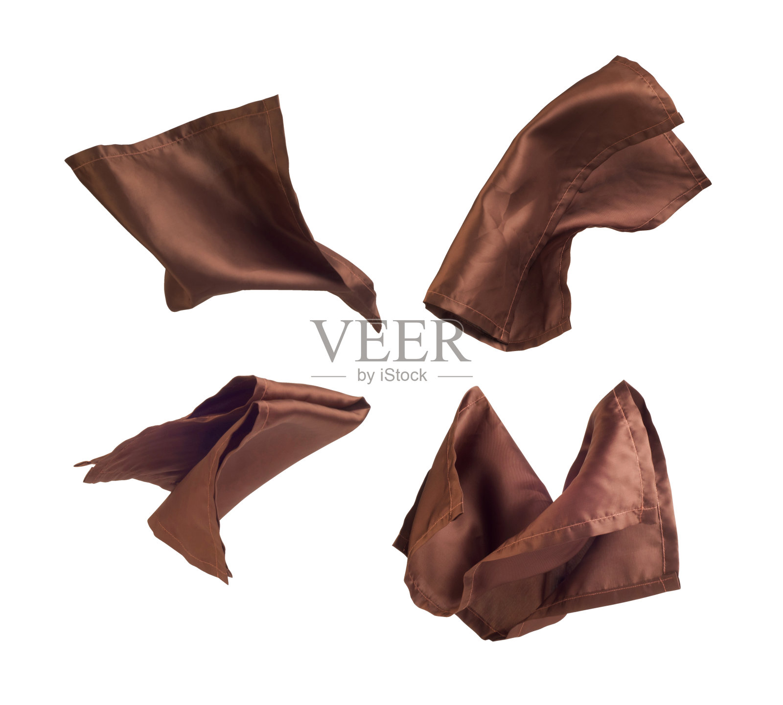 一套在白色背景上飞行的棕色织物照片摄影图片