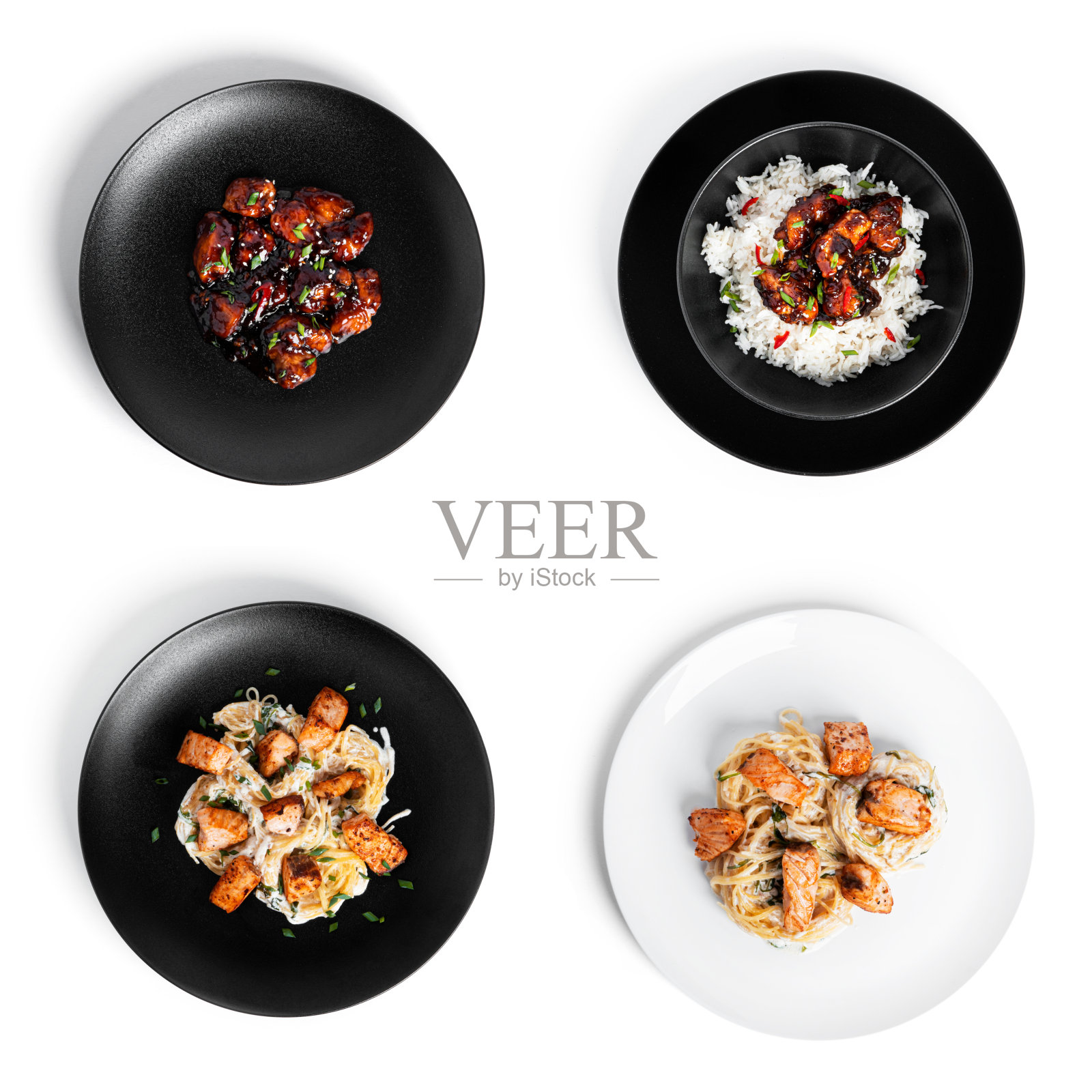 日本菜和意大利菜。三文鱼宽面和红烧鸡饭。孤立在白色背景上照片摄影图片