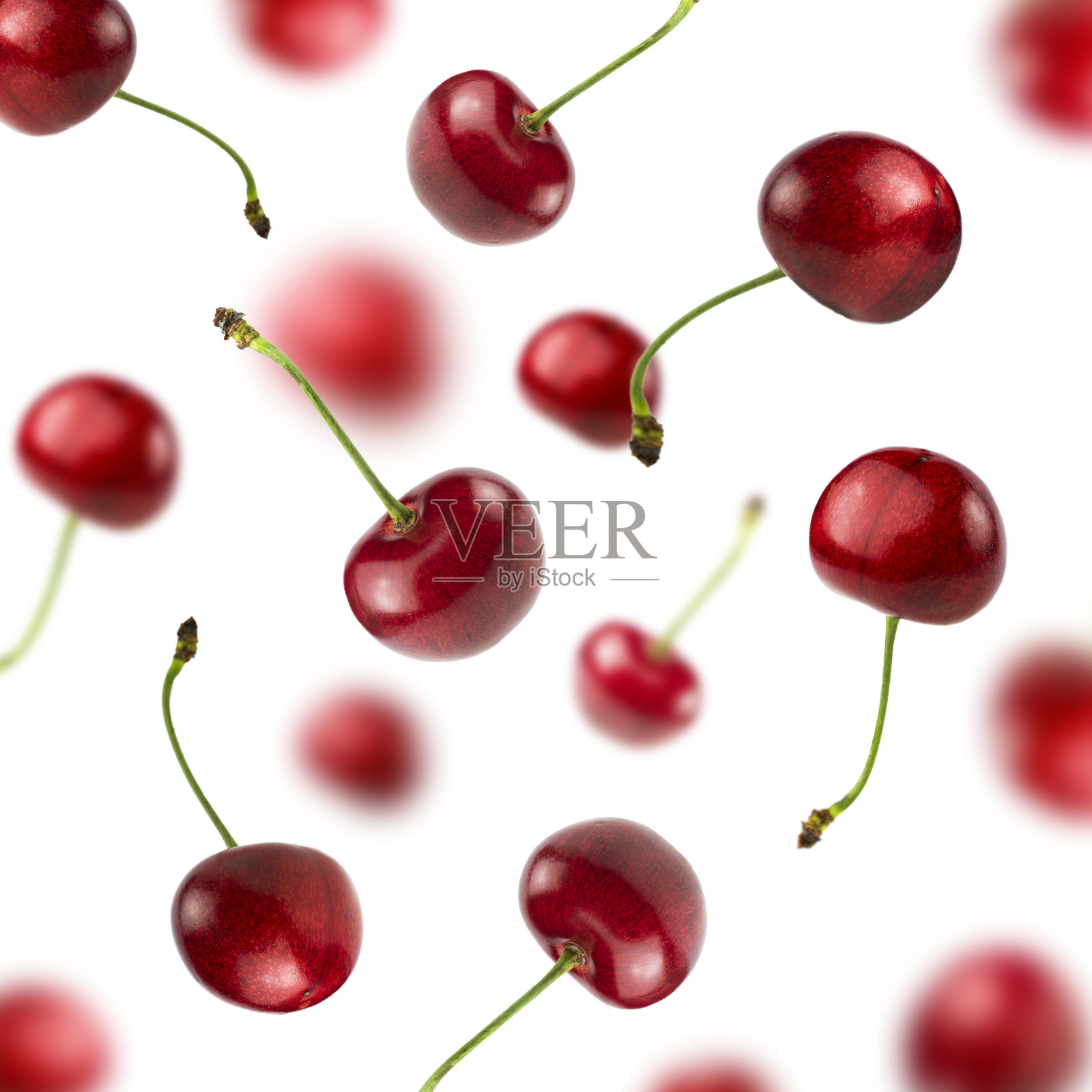 落下来的甜樱桃孤立在白色的背景。照片摄影图片