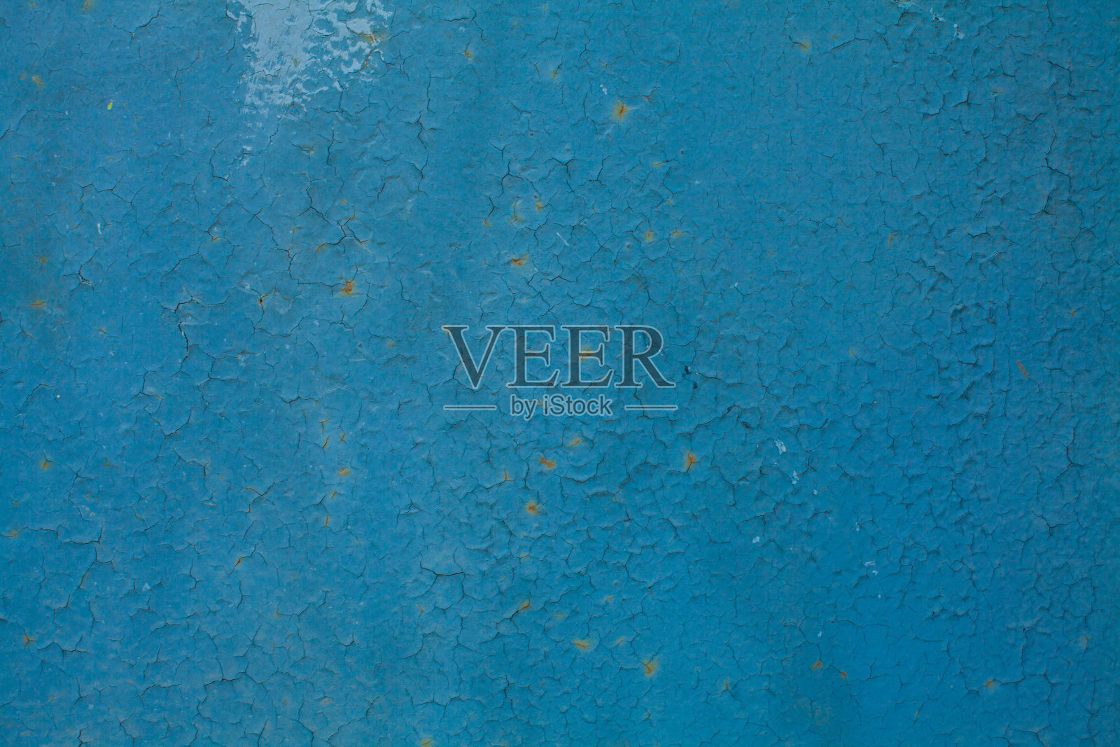 蓝色灰泥墙背景有裂缝照片摄影图片