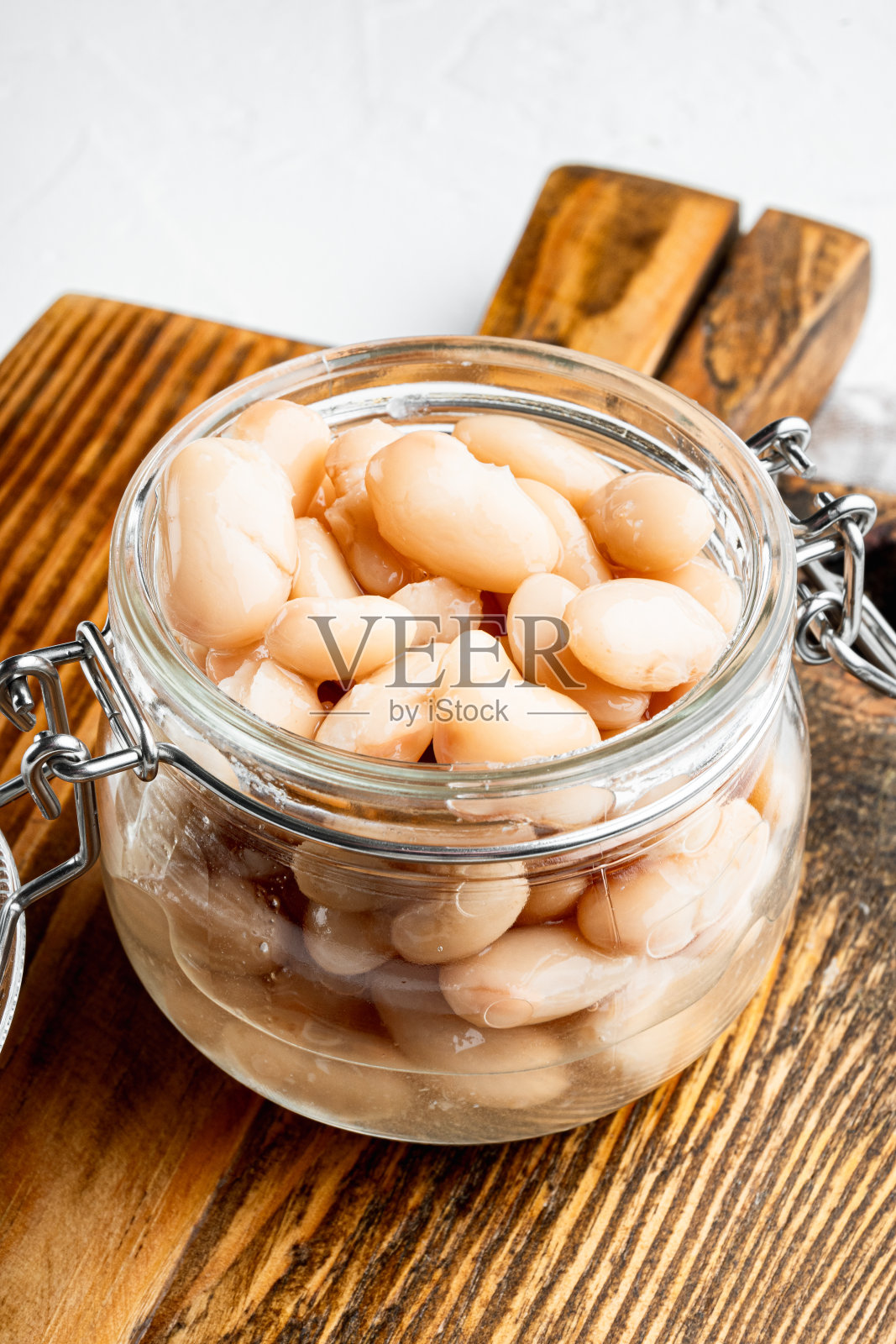 白芸豆，玻璃罐中，白石表面照片摄影图片