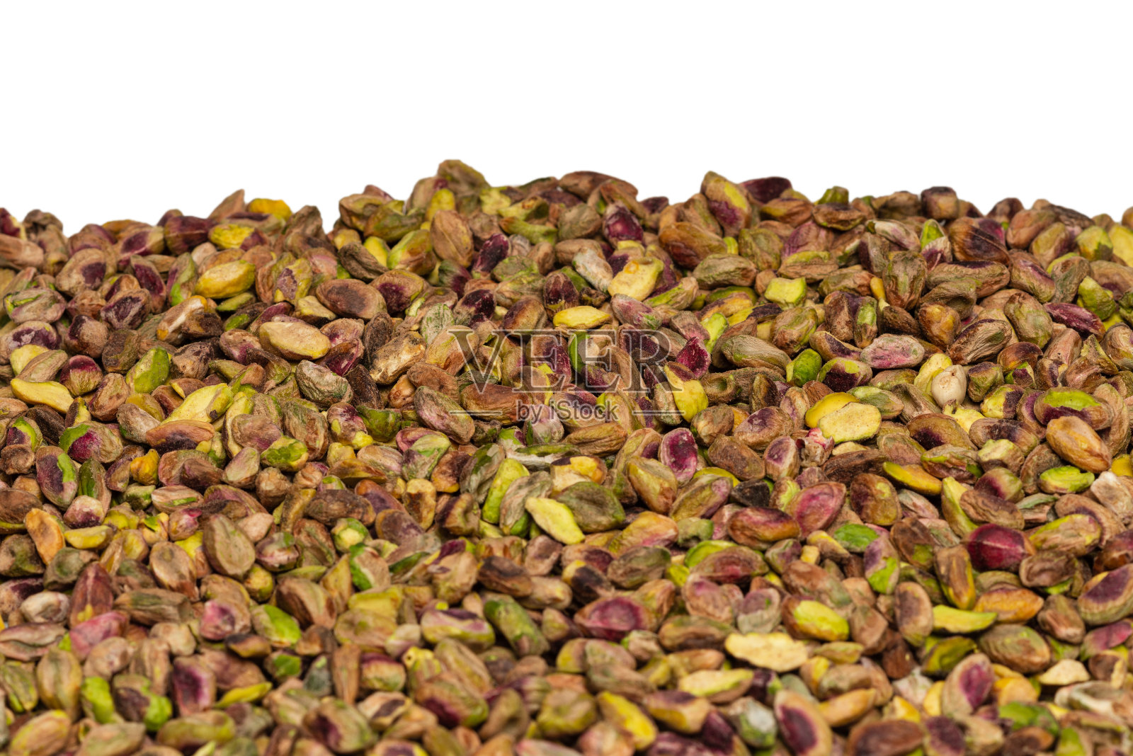 剥皮美味的开心果作为背景。照片摄影图片