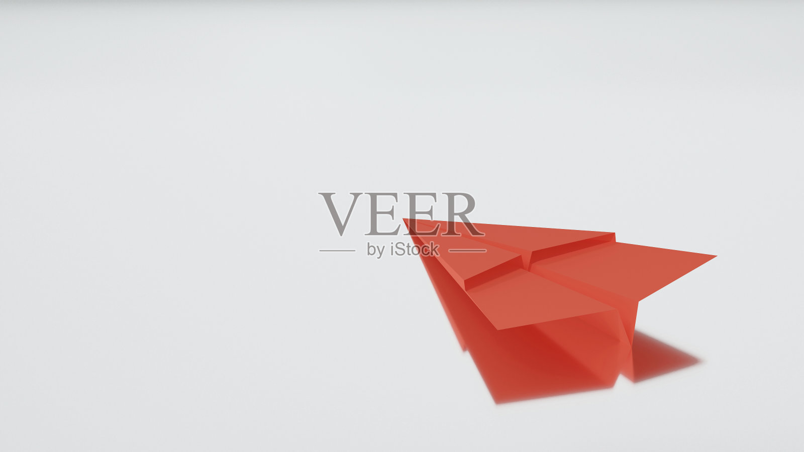 一架红色的纸飞机，在白色的背景上反射照片摄影图片