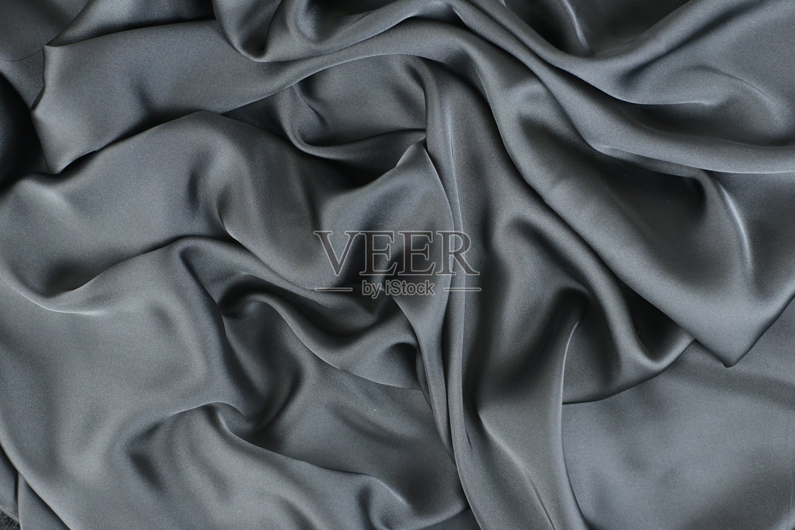 光滑优雅的丝绸或缎子质地可以用作抽象的背景。奢华的背景设计照片摄影图片