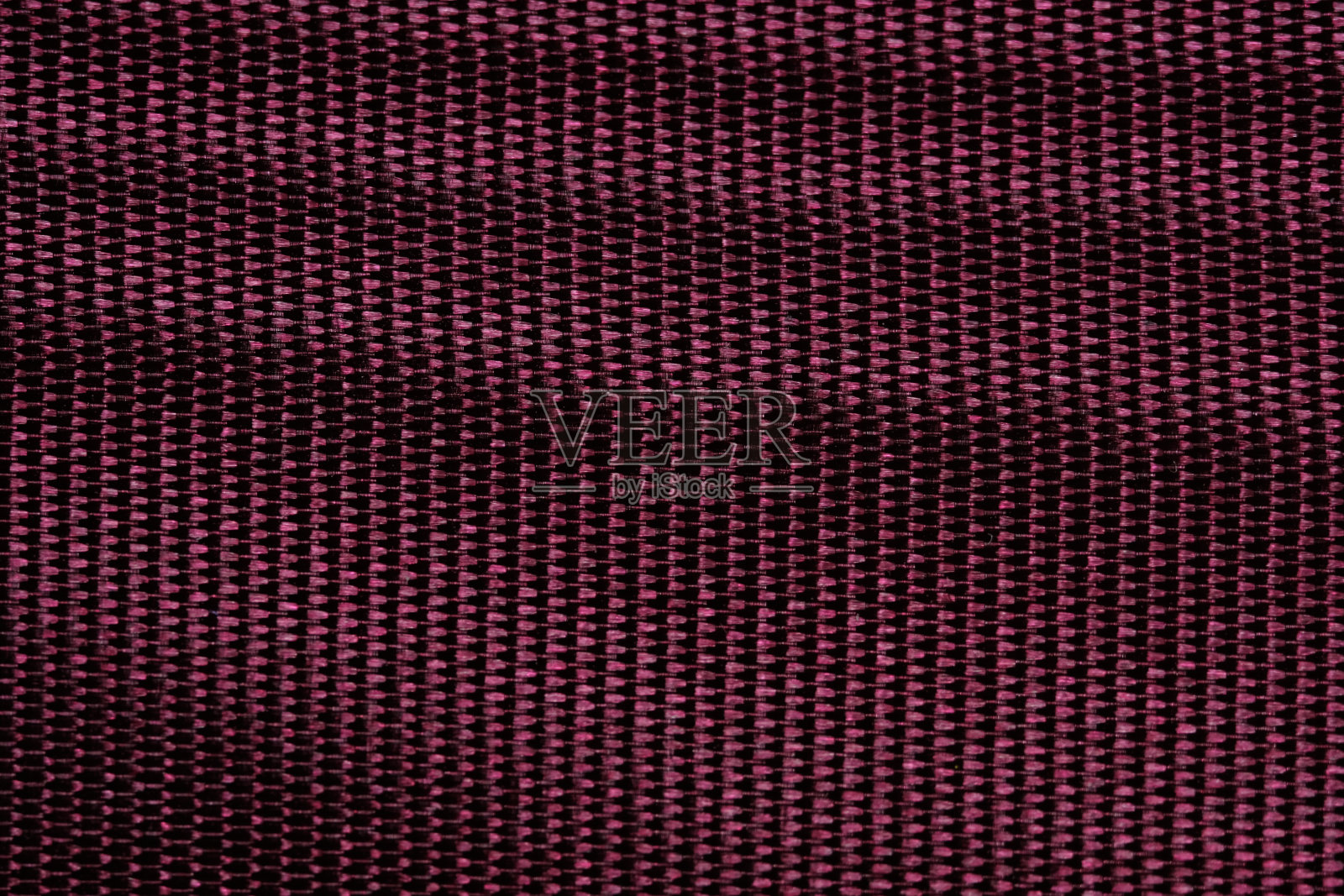 红色的栗色丝绸织物纹理背景。照片摄影图片