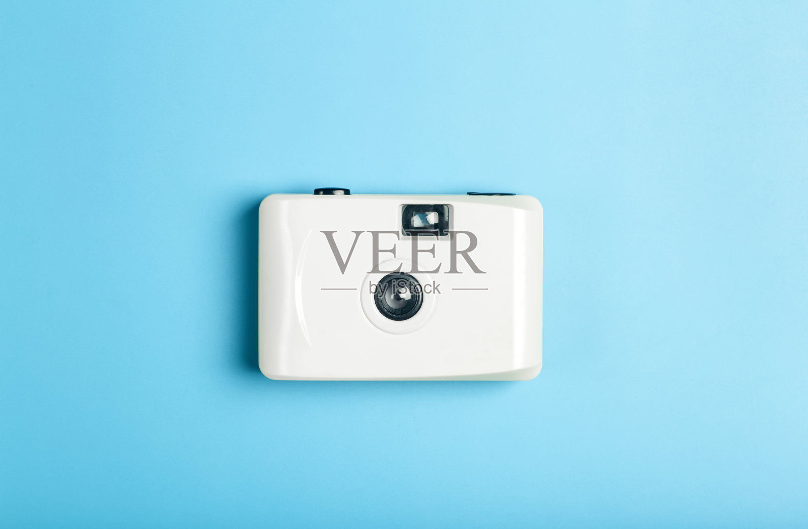 电影摄影机在一个颜色最小的背景。摄影、生活方式的概念照片摄影图片