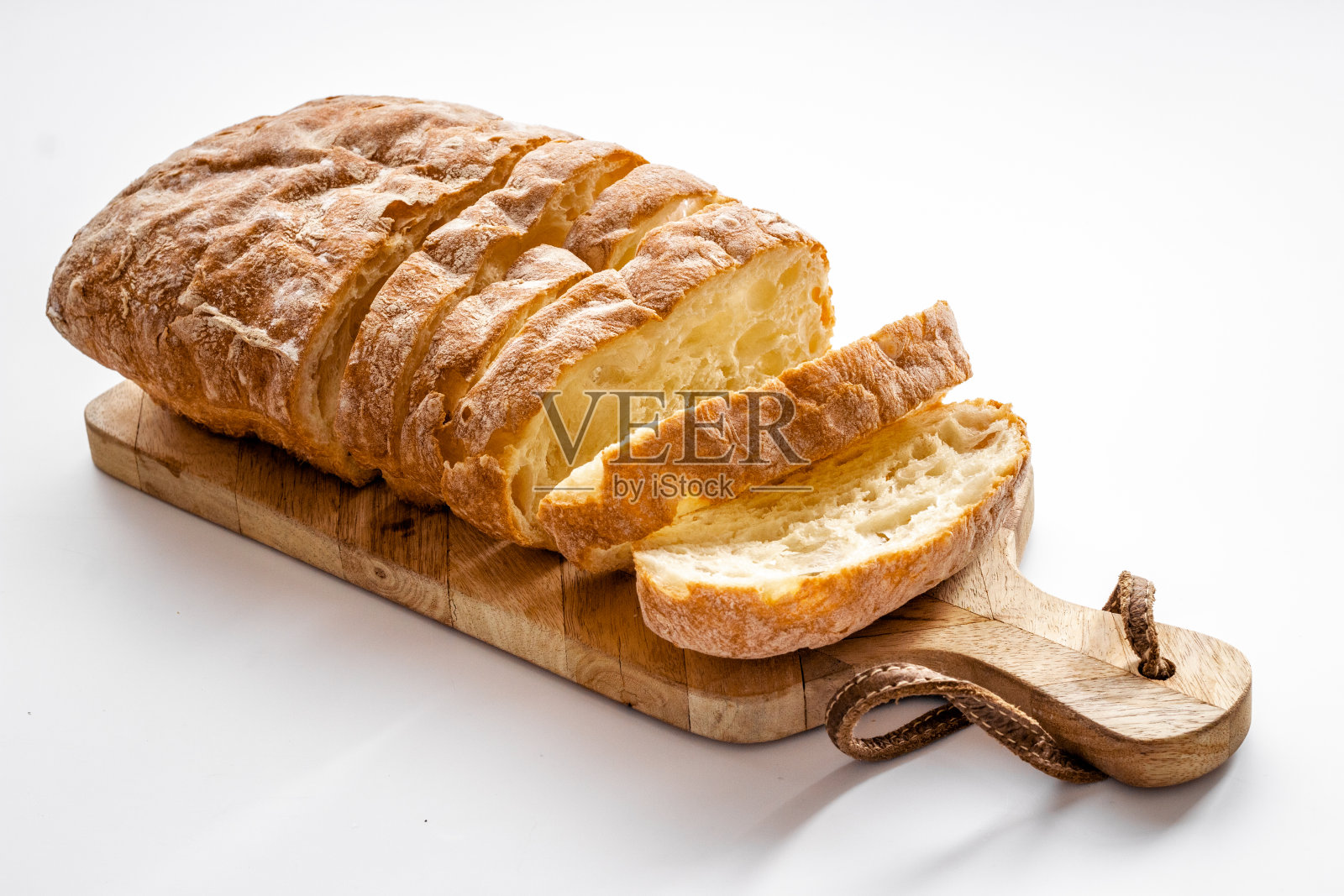 新鲜面包，意大利脆皮面包。面包店的背景照片摄影图片