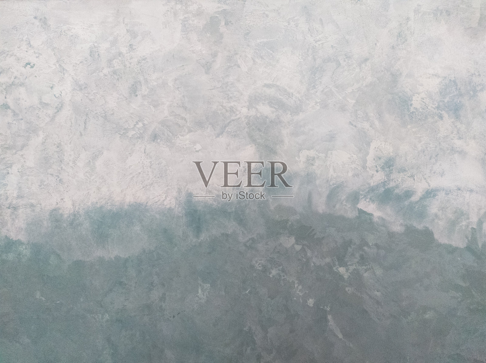 灰泥墙纹理背景。梯度腻子。从灰色到绿色的过渡。照片摄影图片