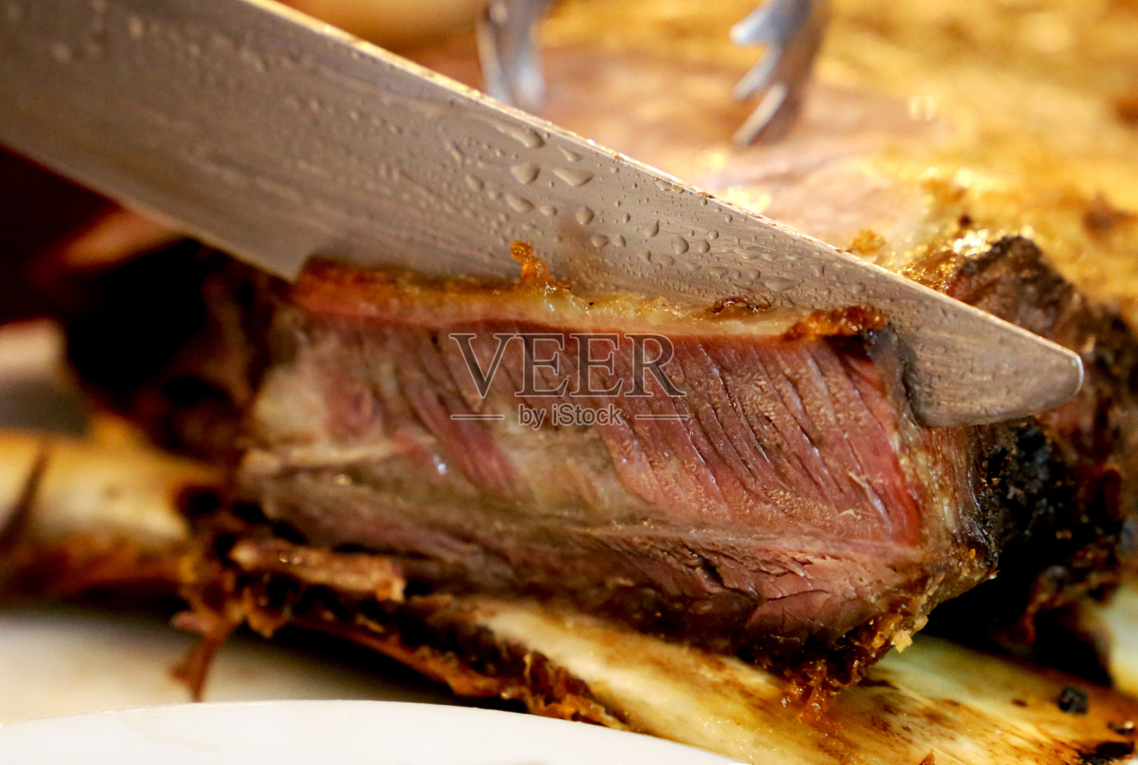Costela密切起来。巴西美味的烤骨排骨照片摄影图片