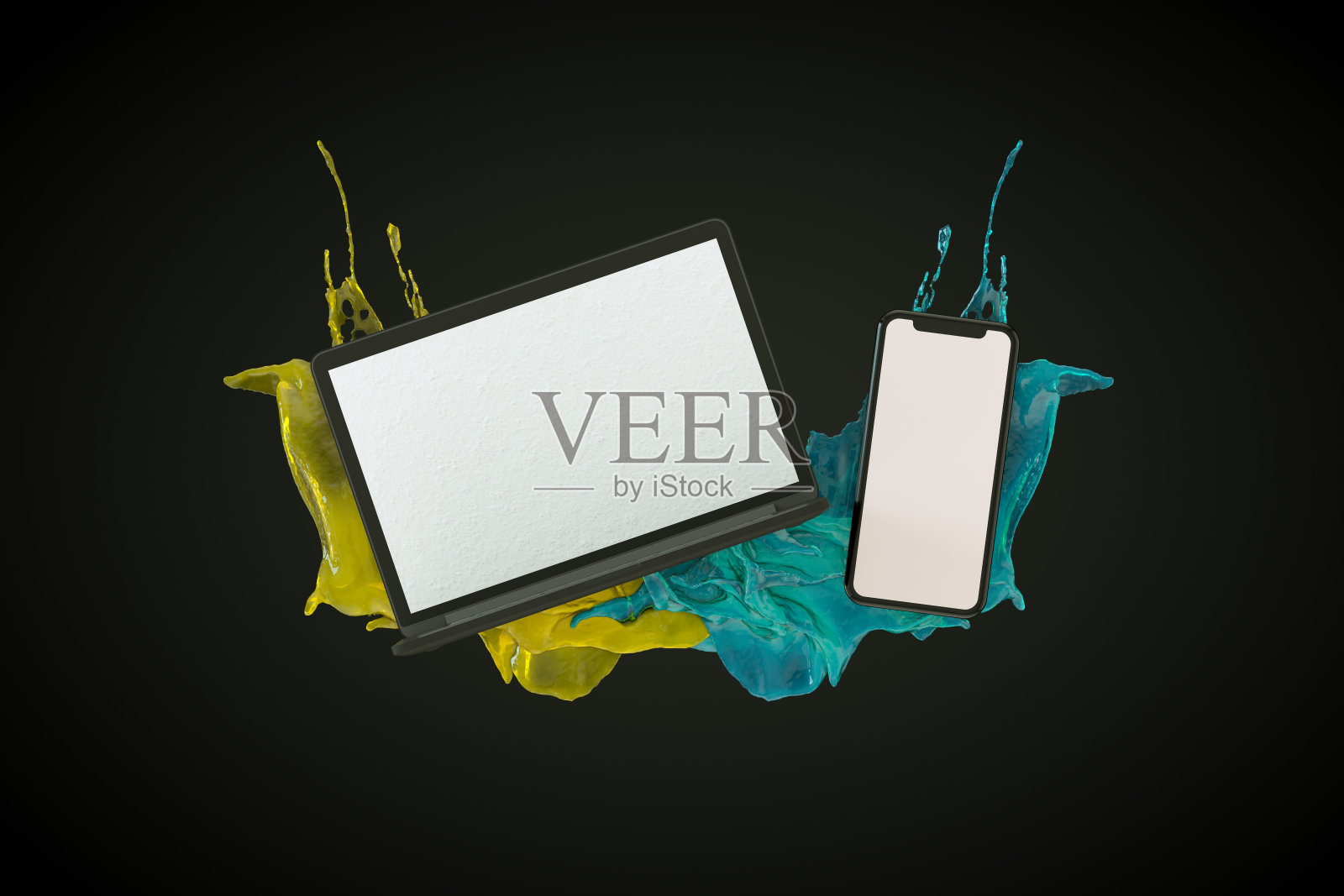 智能手机和笔记本电脑与液体油漆飞溅在黑色背景照片摄影图片