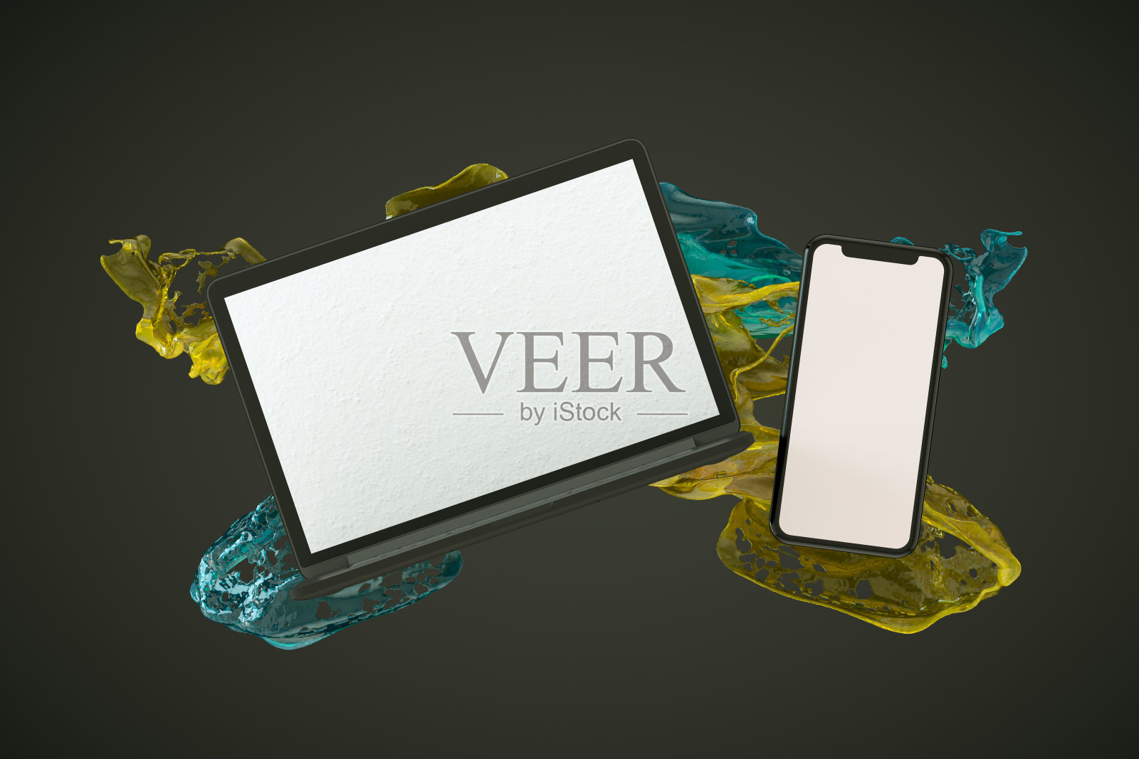 智能手机和笔记本电脑与液体油漆飞溅在黑色背景照片摄影图片