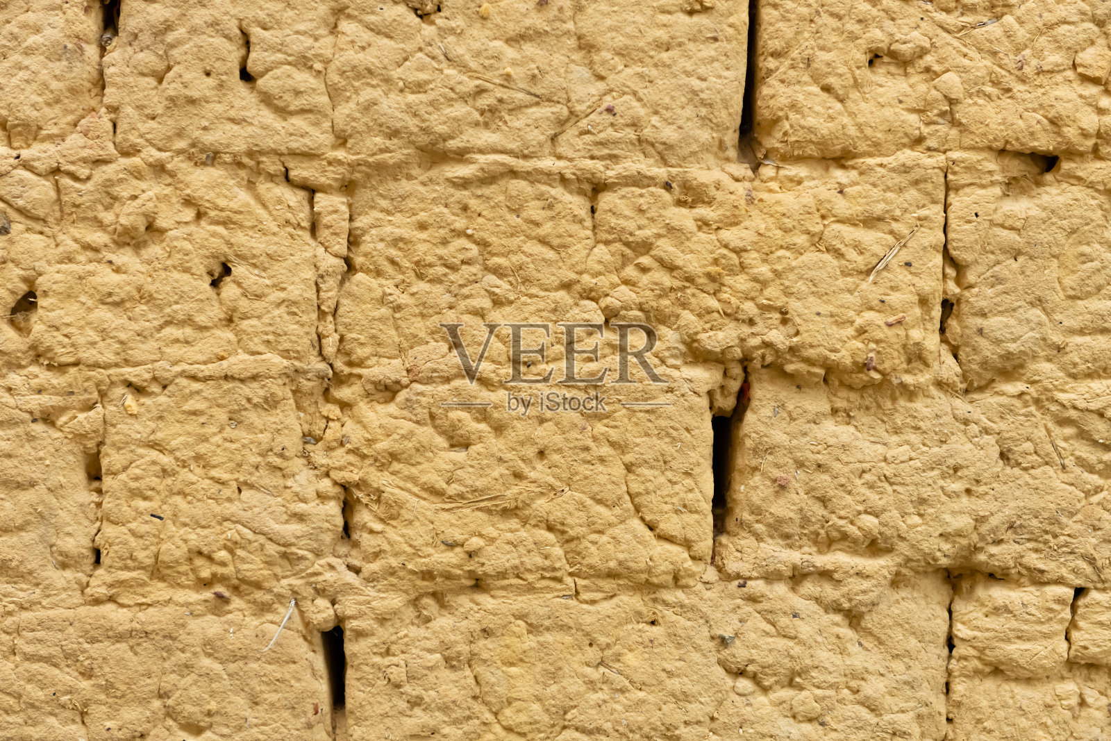 以泥砖为背景和纹理的墙照片摄影图片