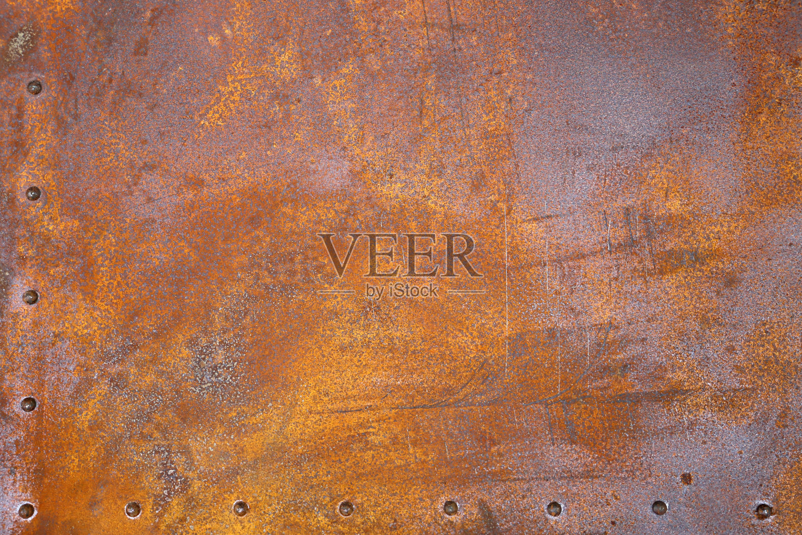 生锈的铁材质。带铆钉的铁板照片摄影图片