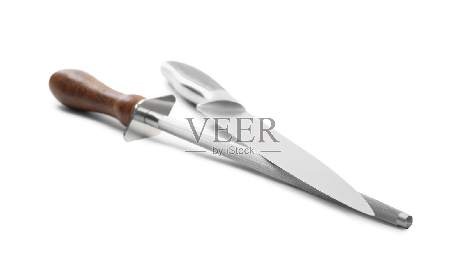 在白色背景上磨钢和刀照片摄影图片