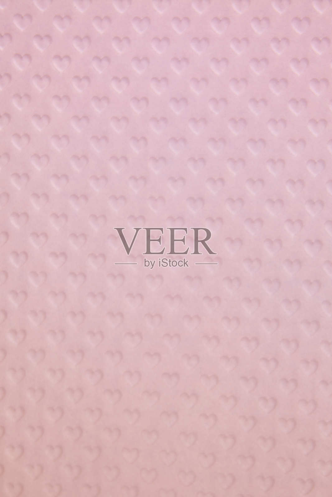 粉红色的背景与纹理的心。情人节的概念。节日的背景照片摄影图片