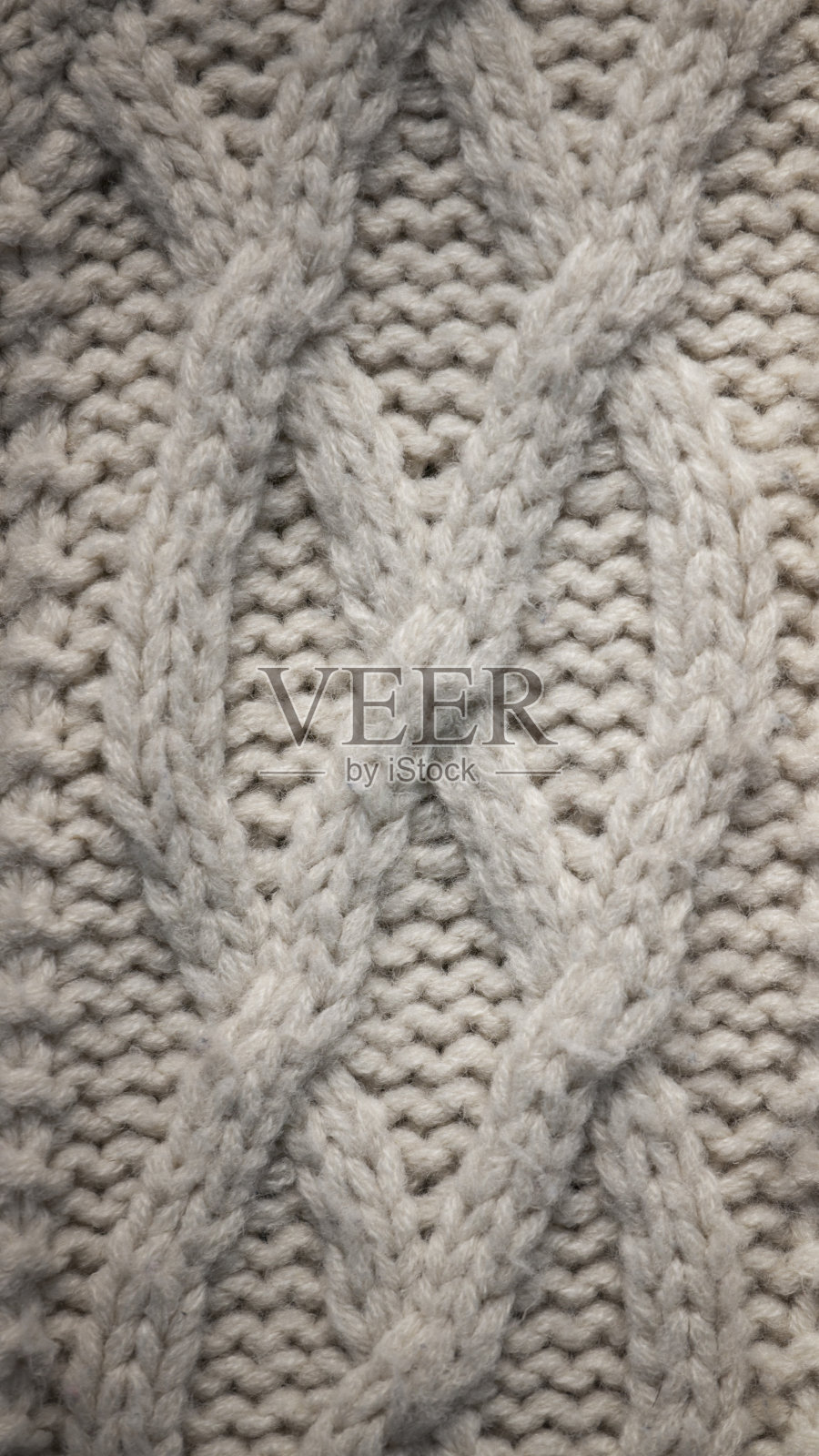 编织压纹在白色羊毛毛衣照片摄影图片