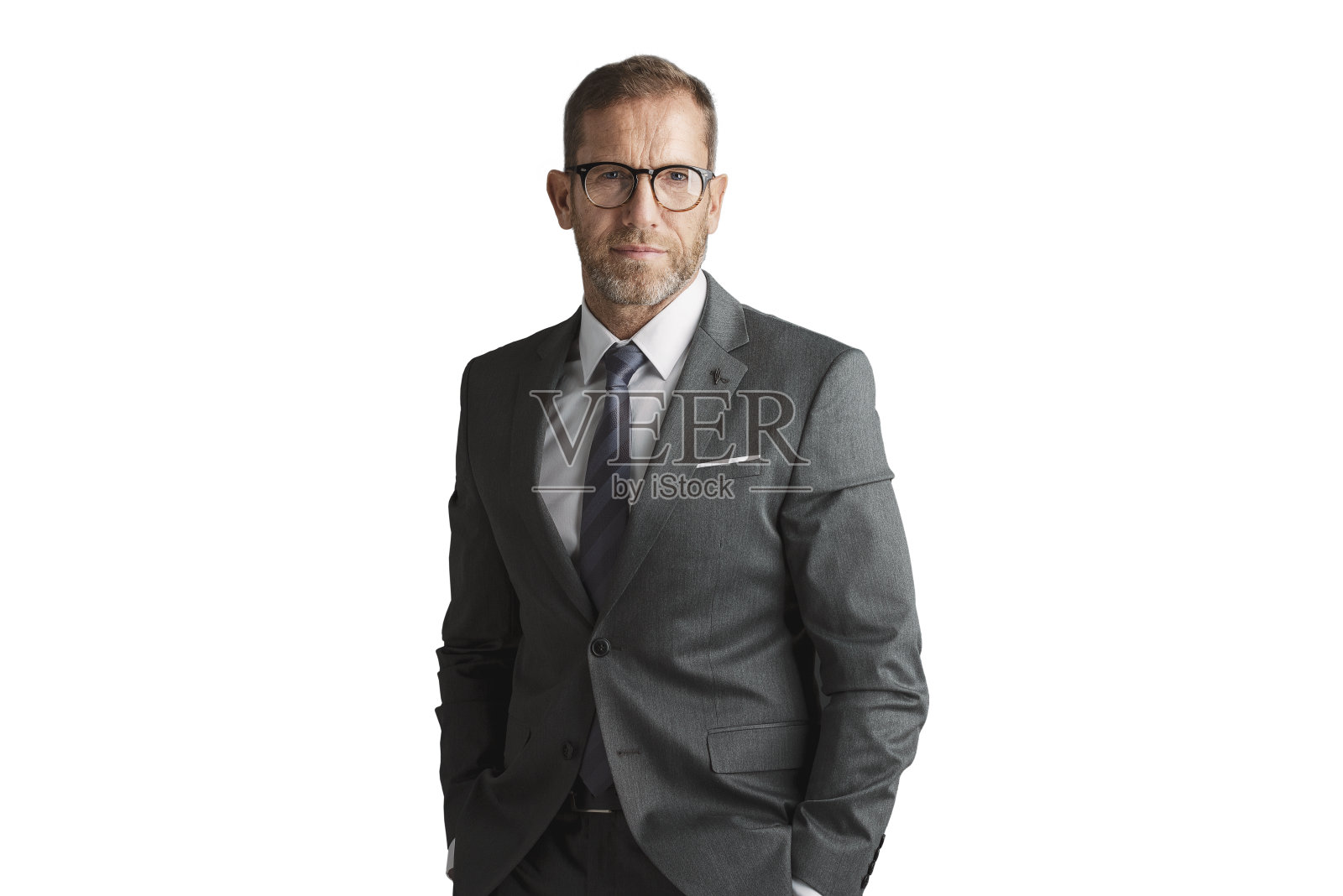 中年商人穿西装打领带，站在一个孤立的背景照片摄影图片