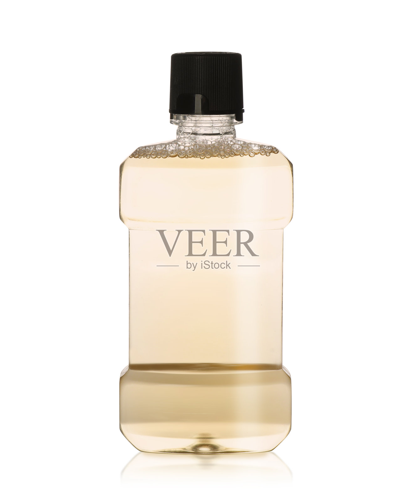 瓶内装有漱口水，用于牙齿护理，隔离上白照片摄影图片