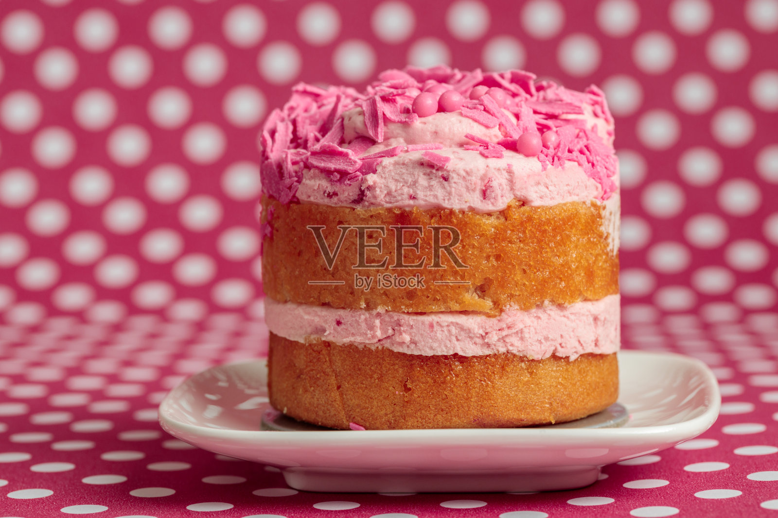 粉红色糖衣的小蛋糕照片摄影图片