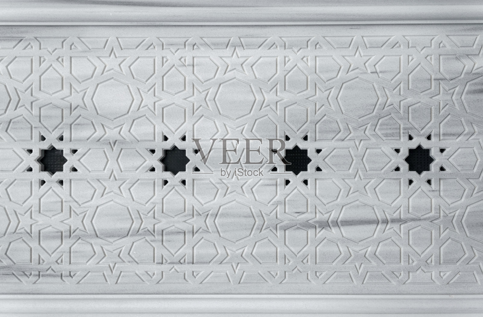 东方风格的石雕花卉墙照片摄影图片