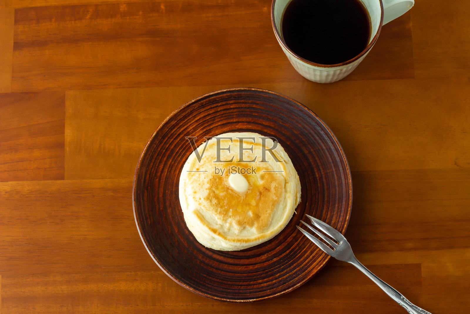 黄油煎饼和一杯咖啡照片摄影图片