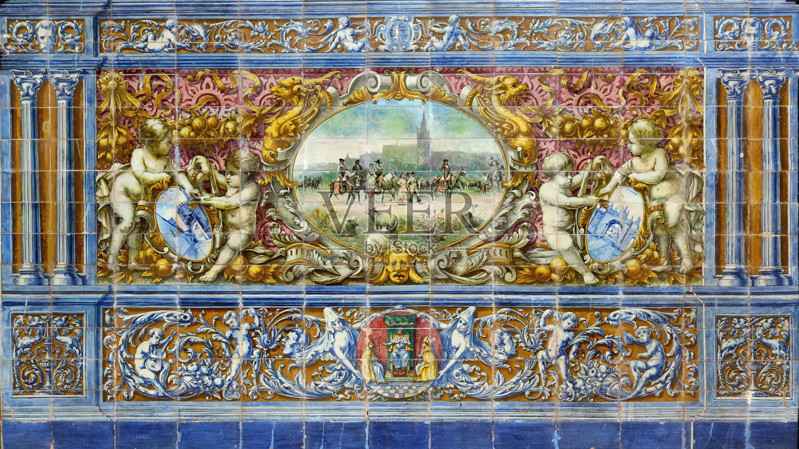 西班牙塞维利亚广场的长椅上，安达卢西亚的瓷砖上画着历史场景，代表着牲畜照片摄影图片